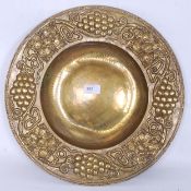 A hand beaten Arts & Crafts brass charge