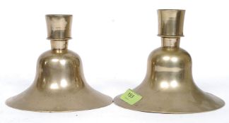 A near pair of Islamic brass candlestick