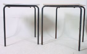 A pair of retro industrial school tables