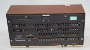 A vintage wooden cased Bush VHF91 valve