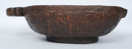 A large hardwood carved African grain bo