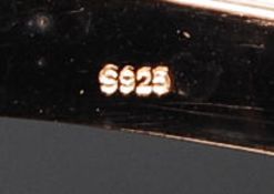 A silver gilt cartier style bangle with CZ stones all around the central roundels. Total weight 17.