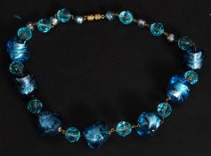 A vintage Bohemian turquoise and foil set glass bead necklace.