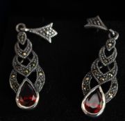 A silver marcasite and garnet set pair of drop earrings. Total weight 4.7g.