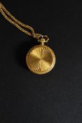 A decorative yellow metal ladies fob watch and chain by Norma having 17 jewel movement in chase