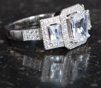 A silver and CZ Dress ring. Total weight 5.9g / Size R.