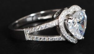 A silver and heart shaped cz ring. Total weight 3.