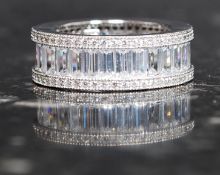 A silver and baguette cz full eternity ring. Total weight 6.