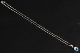 A silver kerb linked necklace with blue stone pendant in silver clasp. Total weight 6g.