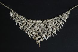 A 1970's Indian silver white metal vintage retro v-shaped multiple string silver white metal
