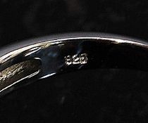 A ladies contemporary hexagonal head silver and cz stone inset dress ring. Total weight 4.9g .