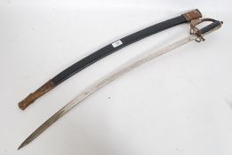 An Indian cowbow sword complete with leather scabbard.