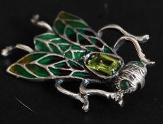 A silver and enamel bug brooch inset with peridot stone. Total weight 4.4g.