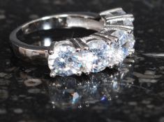 A silver and cz five stone dress ring. Total weight 5.