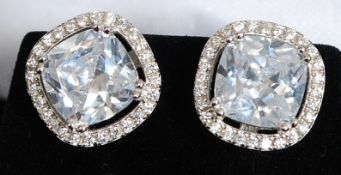 A pair of white metal silver 925 and cz stud earrings.