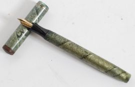 A vintage 20th century Mentmore Supremen Lever Fill Fountain Pen  having snakeskin effect cap and