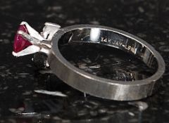 A ladies 14ct white gold ruby and diamond ring.