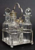 A vintage silver plate and cut glass cruet set  on stand.