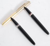 A  mid century Comet vintage fountain pen with glass reservoir to centre having black and gold trim