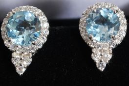 A pair of silver cz and aquamarine earrings. Total weight 5.6g.