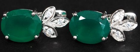 A pair of silver and jade ear stud - earrings. Total weight 6.1g.