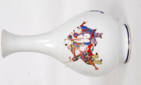 A 20th century Fukagawa vase of baluster form with white ground decorated with children at play.