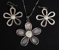 A silver flower head pendant and necklace together with 2 matching earrings.