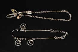 A contemporary ladies silver charm bracelet together with another charm bracelet. Total weight 8.