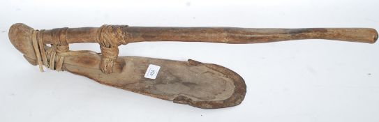 A Polynesian Adze of hardwood form - Primitive tool bound with a basket weave with cast iron