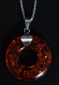 A silver and amber style pendant necklace on silver chain. Total weight 7.5g.