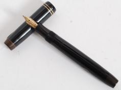 A vintage black and gold trim finished Geo S Parker '  Parker Vacumatic ' fountain pen with 14ct