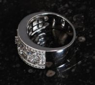 A ladies 925 silver cz stone pave set and cross over cocktail / dress ring. Total weight 7.