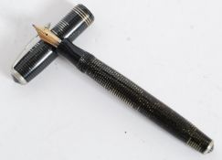 A 1936 Canadian silver / pearl striped Parker Vacumatic fountain pen with Parker arrow head nib.