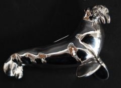 A vintage D'Orlan white metal brooch in the form of a walrus.
