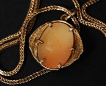 A 9ct gold snake link square chain necklace complete with a cameo portrait pendant. Total weight 4.