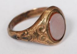 A Victorian 9ct gold agate stone ring, The oval stone set in decorative mount. Weight 2.