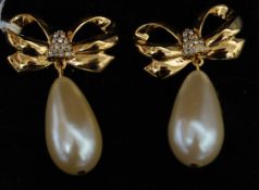 A pair of vintage yellow metal Elizabeth Taylor ' white diamonds ' drop earrings of ribbon form