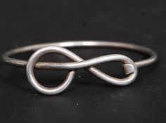 A contemporary silver swirl set ladies bracelet. Stamped 925.