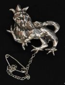 A silver brooch in the form of a passant crowned lion with pin to verso. Total weight 7.