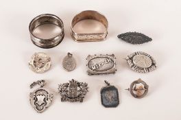 A Collection Of Eleven Silver Medals including two silver napkin holders. All pieces fully