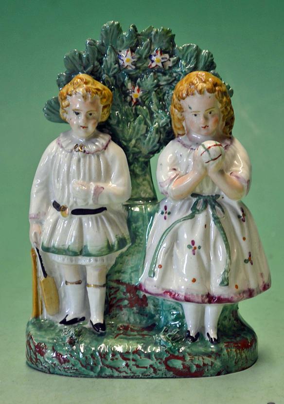 Original Vic Staffordshire ceramic cricket group of figures - comprising a boy holding a cricket bat