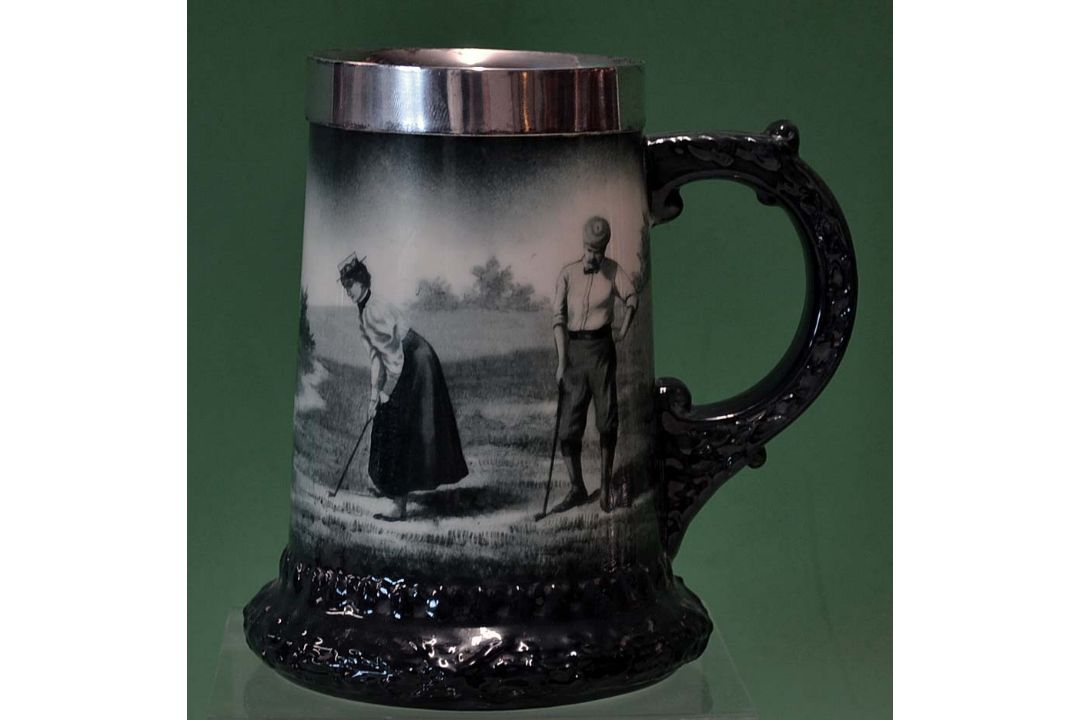 Fine Lenox ceramic and silver rimmed golfing tankard c1900 - decorated with a lady putting watched