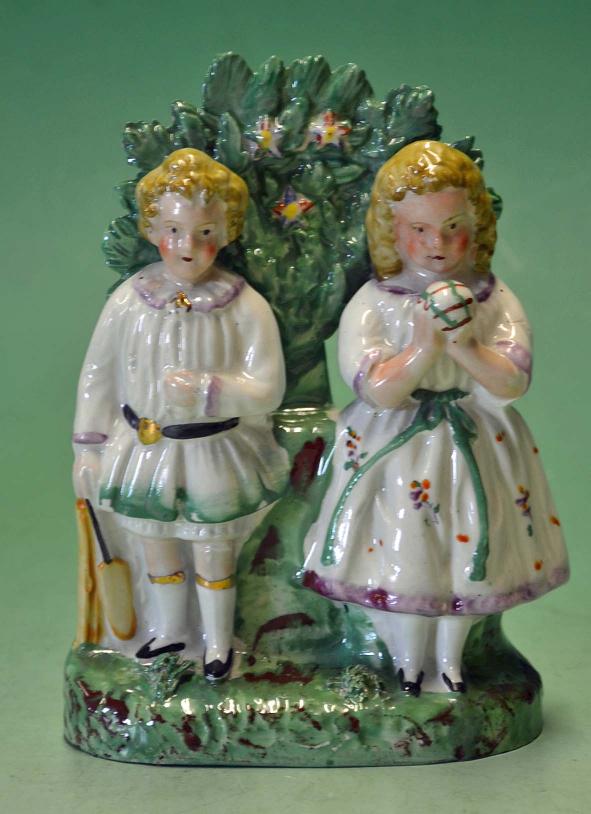 Original Vic Staffordshire ceramic cricket group of figures - comprising a boy holding a cricket bat