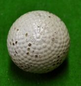 The Colonel bramble pattern rubber core golf ball unused but with some surface cracking