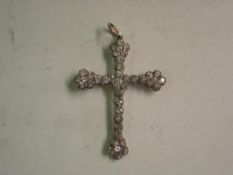 A White Stone Pendant The stones set in gold backed silver. 1 ¾