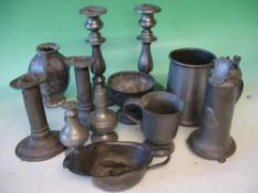 A Collection of Various Pewter Comprising two pairs of candlesticks, two pepperettes, sauce boat,