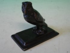 A Bronze Figure of an Owl The down swept base signed 