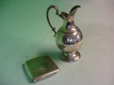 A Silver Cigarette Case Birmingham 1918-19. 3ozs 4dwt, together with a plated ewer. 6 ½