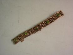 9ct Multi-link Bracelet Set with seven peridot stones. 24grms