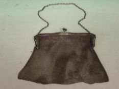 A Silver Lady's Evening Bag. Of fine chain mesh with ball form clasp. London 1922-1923. 6 ¼